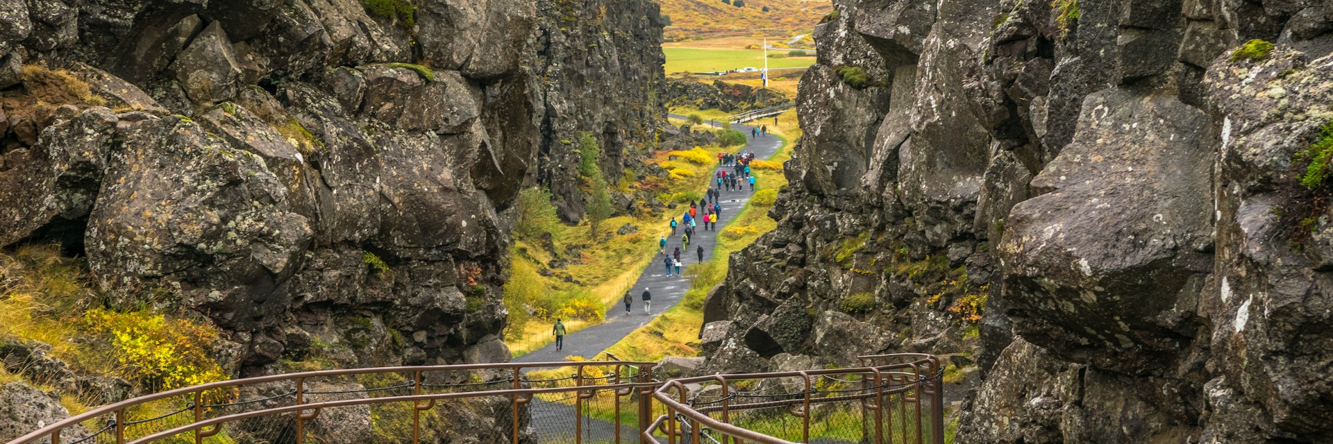 Iceland - Thingvellir National Park, October, 10, 2014 - Beautiful view of people walking in the seam between the Eurasian and North American tectonic plates.