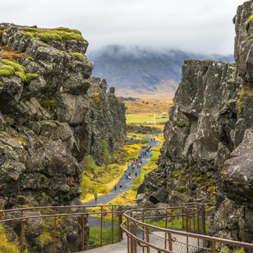 Iceland - Thingvellir National Park, October, 10, 2014 - Beautiful view of people walking in the seam between the Eurasian and North American tectonic plates.