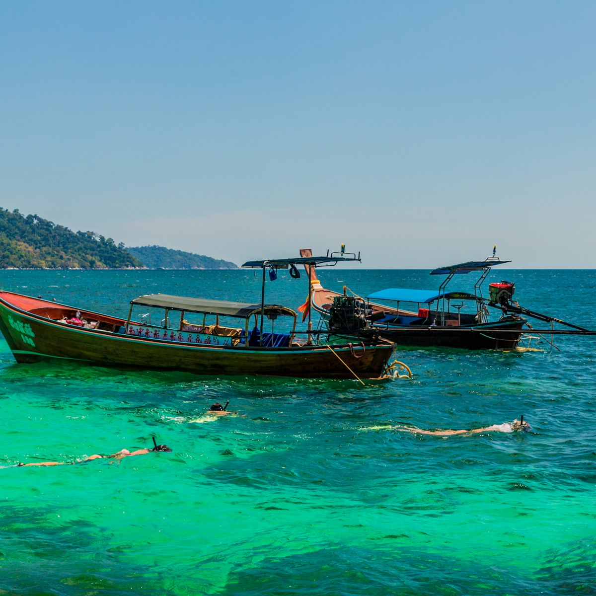 Long tail boats on Ko Rawi in Tarutao national marine park in Thailand.