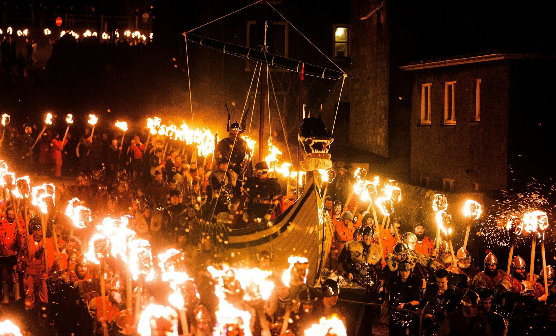 A torchlit procession with a Viking longboat is the culmination of Up Helly Aa festivities in Shetland, Scotland