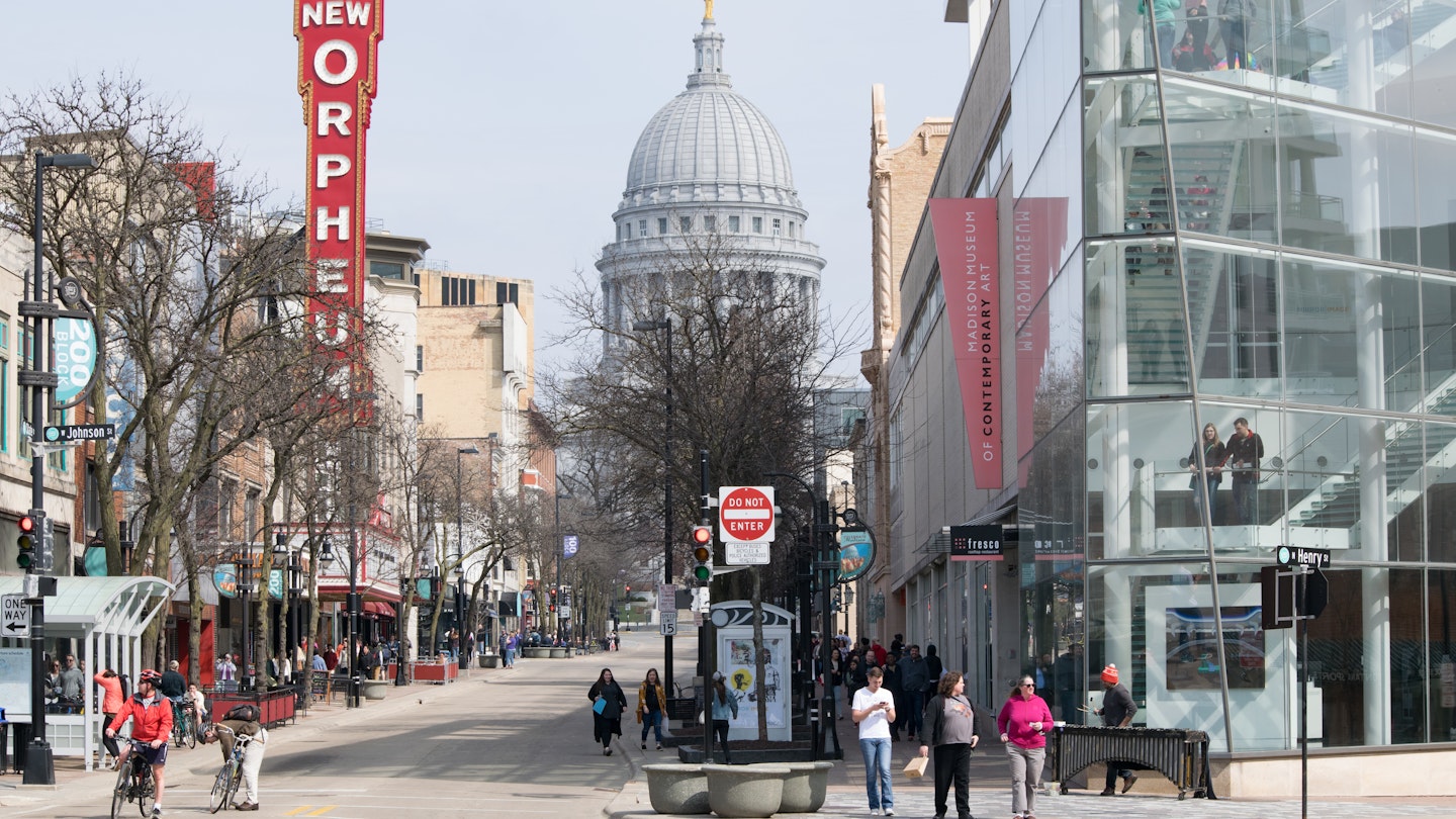 Madison, Wisconsin / USA - June 20, 2019: People Enjoying Shopping and Restaurants on State Street in Madison  Overlooking the Capitol Building and Dome on a Spring Day; Shutterstock ID 1469103266; your: Brian Healy; gl: 65050; netsuite: Lonely Planet Online Editorial; full: Best things to do in Madison