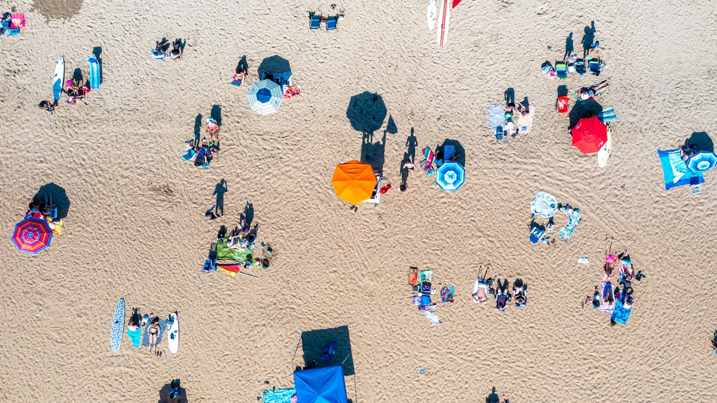 Top down Aerial View of People Relaxing on the Sand in Virginia Beach; Shutterstock ID 2094543796; your: Brian Healy; gl: 65050; netsuite: Lonely Planet Online Editorial; full: Best things to do in Virginia Beach
