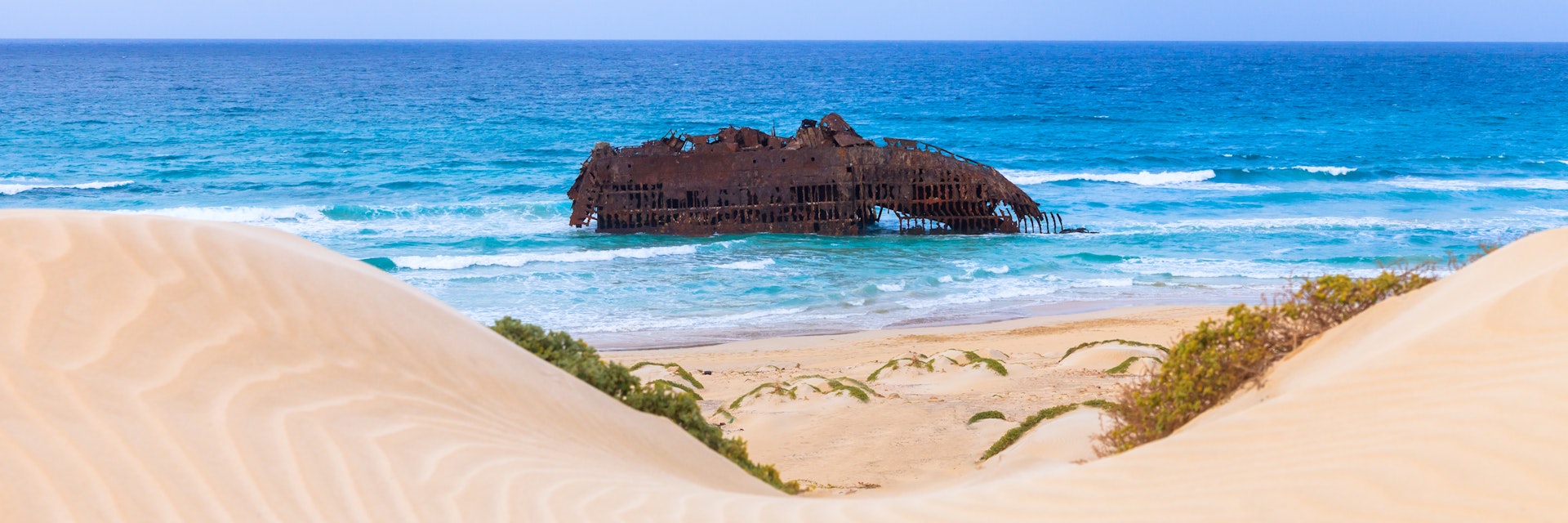 Wreck boat on the coast of boa vista in Cape Verde, Cabo Verde; Shutterstock ID 256852069; your: Erin Lenczycki; gl: 65050; netsuite: Online Editorial; full: Destination Update