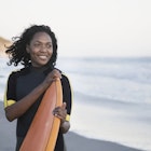 Woman holding surfboard in Santa Barbara