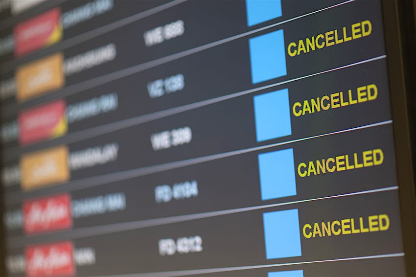 Departure flight board with cancellation at the Airport.