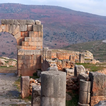 2A56N70 Arch dedicated to the soldier Quintus Memmius Rogatus at the remains of the mountainside ancient Roman city of Tiddis, Algeria, December 2007.