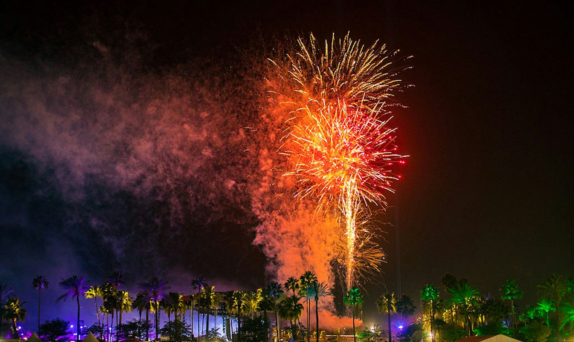 Fireworks light up above palm trees at the Coachella music festival. 