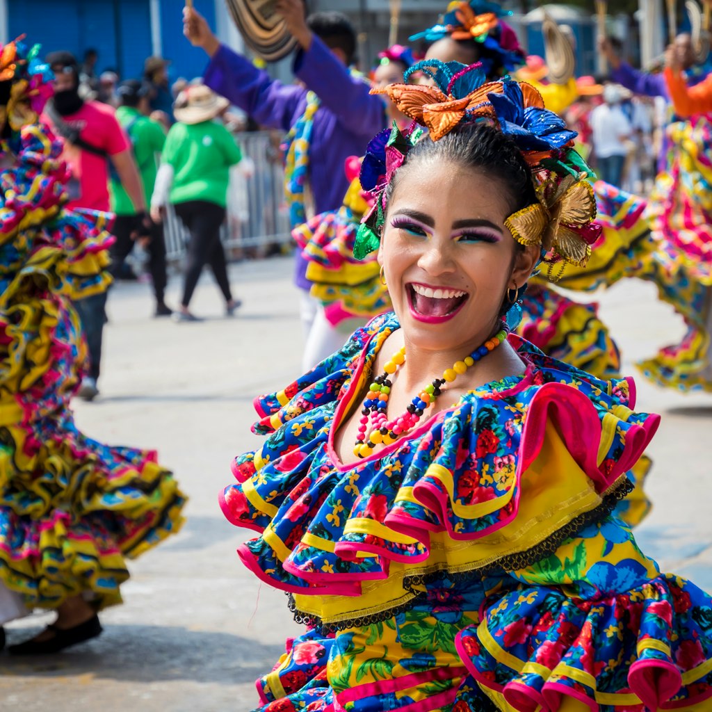 Barranquilla, Colombia. March 4, 2019 - carnival dancers with colorful costumes performing in the great parade in Barranquilla Carnival 2019; Shutterstock ID 1329692129; your: Brian Healy; gl: 65050; netsuite: Lonely Planet Online Editorial; full: Best things to do in Colombia