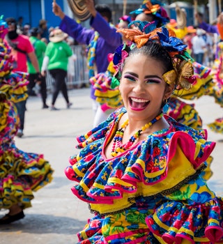 Barranquilla, Colombia. March 4, 2019 - carnival dancers with colorful costumes performing in the great parade in Barranquilla Carnival 2019; Shutterstock ID 1329692129; your: Brian Healy; gl: 65050; netsuite: Lonely Planet Online Editorial; full: Best things to do in Colombia