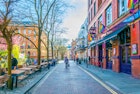 Manchester, UK, April 11, 2017: People are walking in the Gay village alongside Canal street in Manchester, England