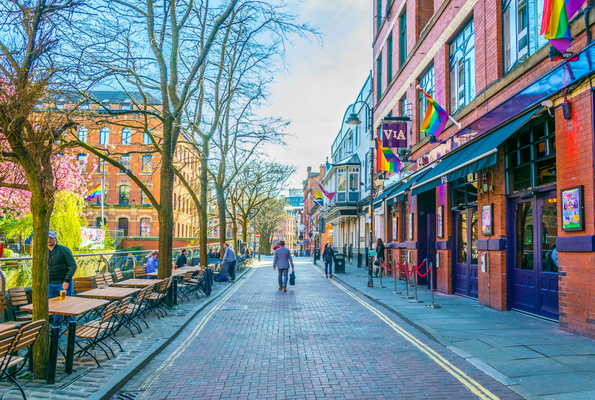 People walking in Gay Village alongside Canal street in Manchester, England 