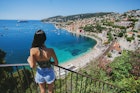 A young woman looking over the beach in Nice, France