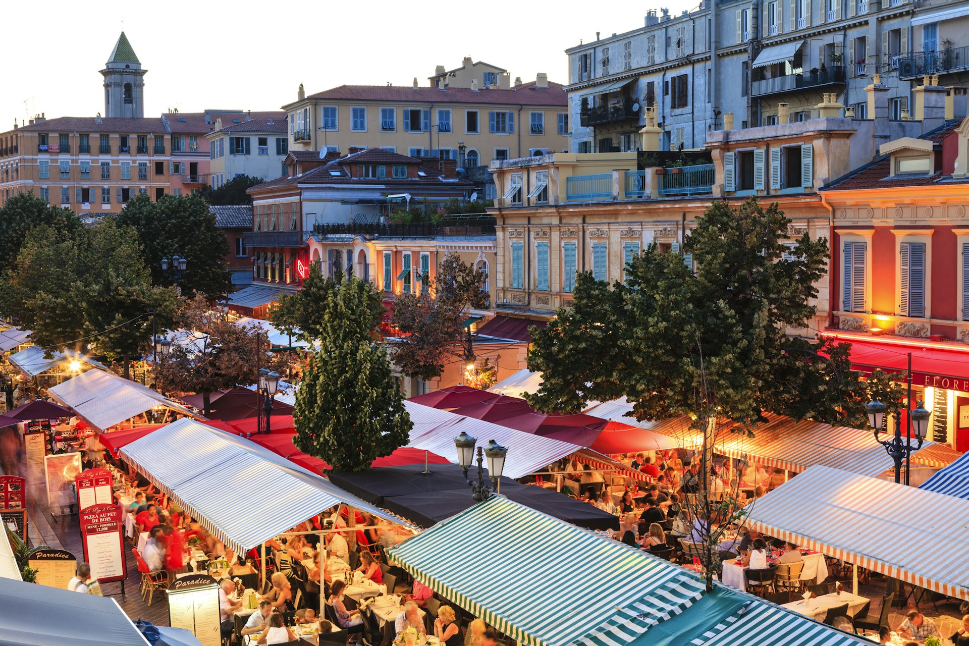 An overhead view of the market stalls of Cours Saleya in Nice at dusk
