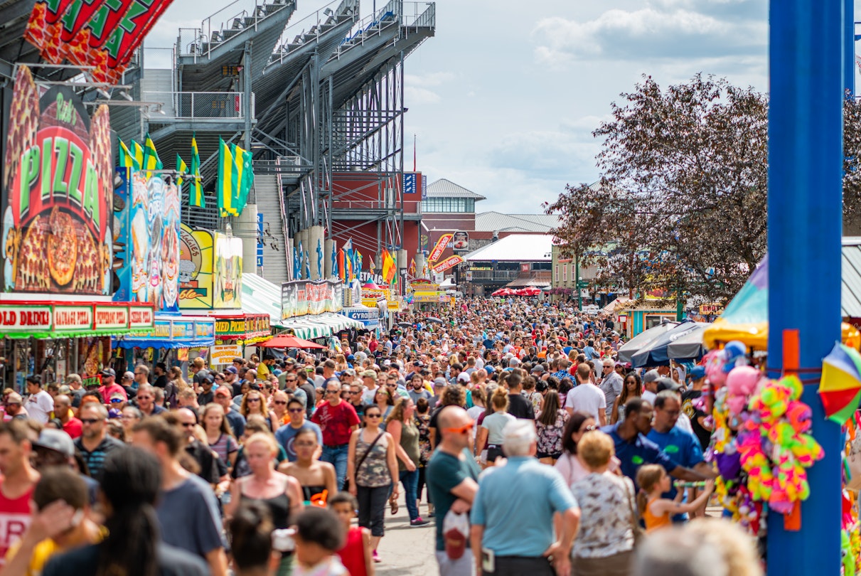 August 10, 2019 Wisconsin State Fair, Milwaukee County, USA. Horizontal photo of crowded patrons at the Wisconsin State Fair on a summer day in July. Milwaukee, WI, USA. Large group of people on a summer day.