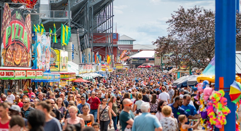 August 10, 2019 Wisconsin State Fair, Milwaukee County, USA. Horizontal photo of crowded patrons at the Wisconsin State Fair on a summer day in July. Milwaukee, WI, USA. Large group of people on a summer day.