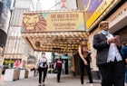 NEW YORK, NEW YORK - JUNE 08: People walk by a billboard for The Lion King at the New Amsterdam Theatre in Times Square on June 08, 2021 in New York City. On May 19, all pandemic restrictions, including mask mandates, social distancing guidelines, venue capacities and curfews were lifted by New York Governor Andrew Cuomo.  (Photo by Noam Galai/Getty Images)