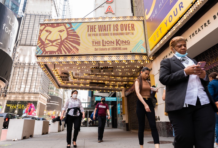 NEW YORK, NEW YORK - JUNE 08: People walk by a billboard for The Lion King at the New Amsterdam Theatre in Times Square on June 08, 2021 in New York City. On May 19, all pandemic restrictions, including mask mandates, social distancing guidelines, venue capacities and curfews were lifted by New York Governor Andrew Cuomo.  (Photo by Noam Galai/Getty Images)