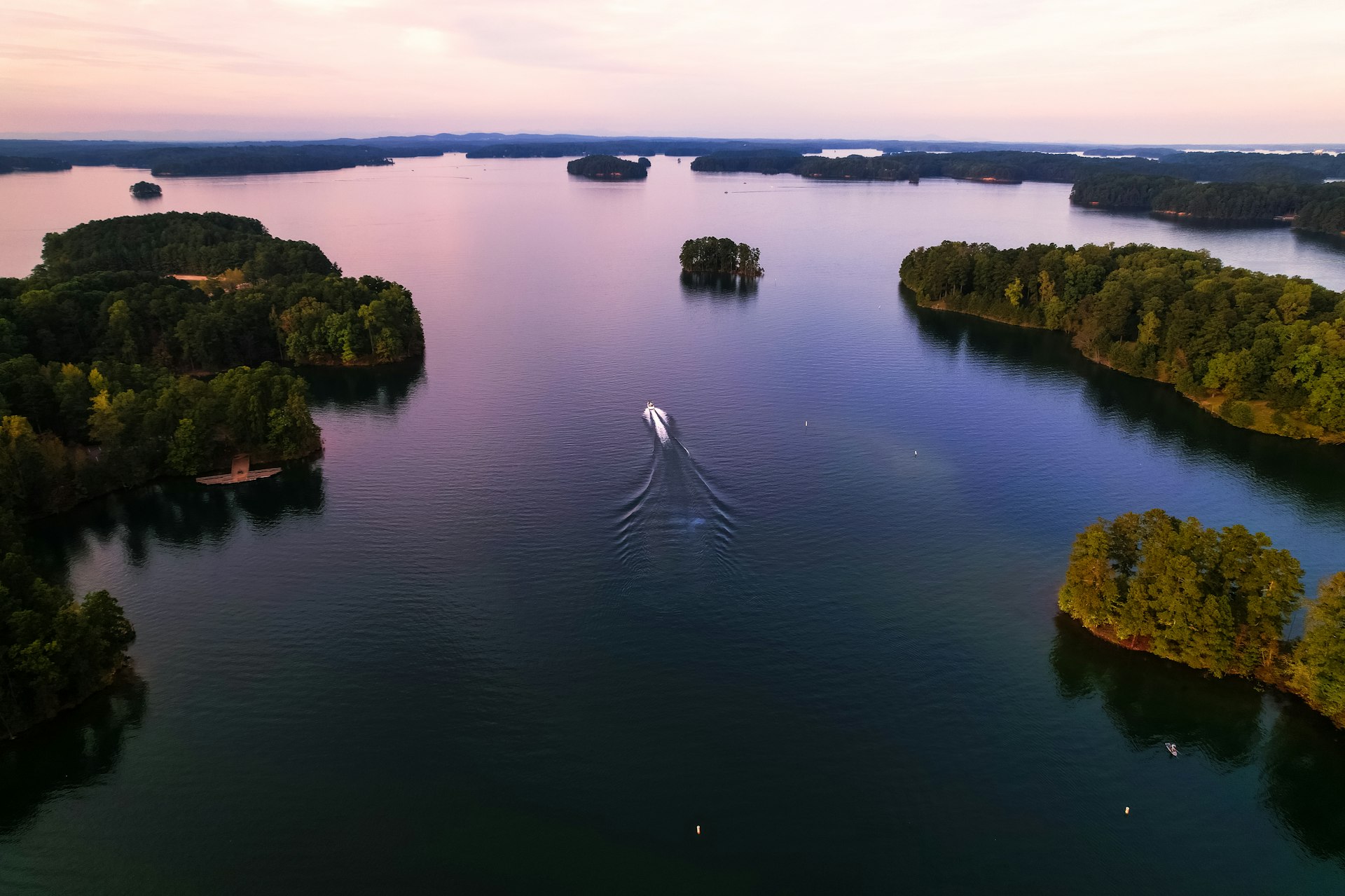 A boat on Lake Lanier at sunset