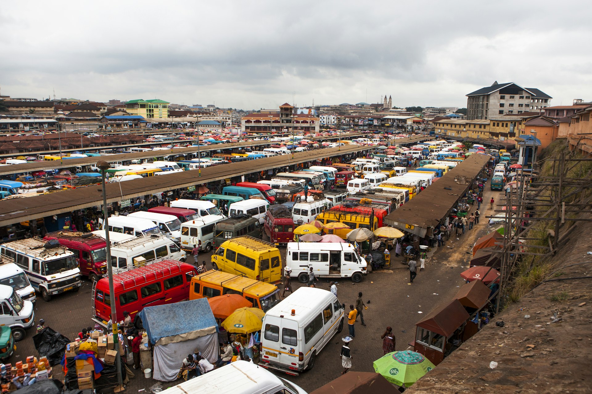 An aerial view of the bus station at Kumasi, Ghana, showing intercity “tro-tro” minbuses