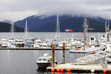 Boats docked at Prince Rupert harbour on a cloudy day.