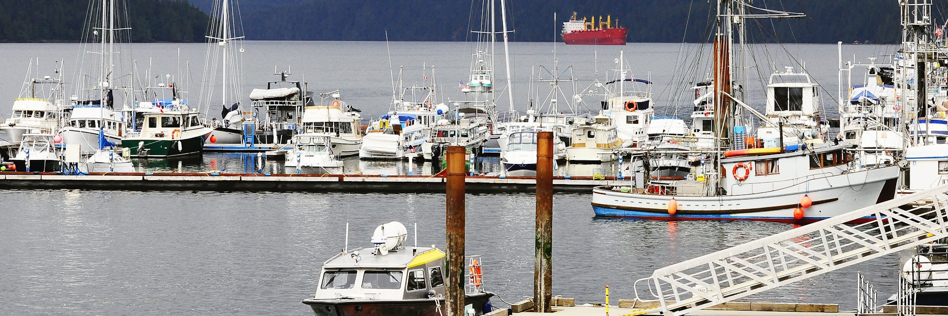 Boats docked at Prince Rupert harbour on a cloudy day.