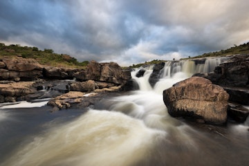 Waterfall at Bourke's luck potholes in the Blyde River. Panorama route, Mpumalanga, South Africa