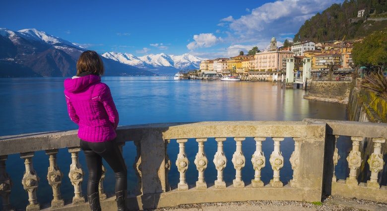 Woman admiring the village of Bellagio during a winter afternoon.