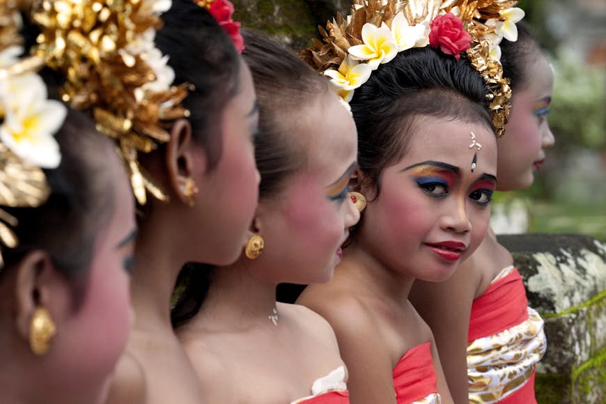 Balinese girls preparing for Pendat dance at Pura Samuan Tiga temple, Bali