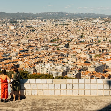 Two women looking over the city of Marseille.