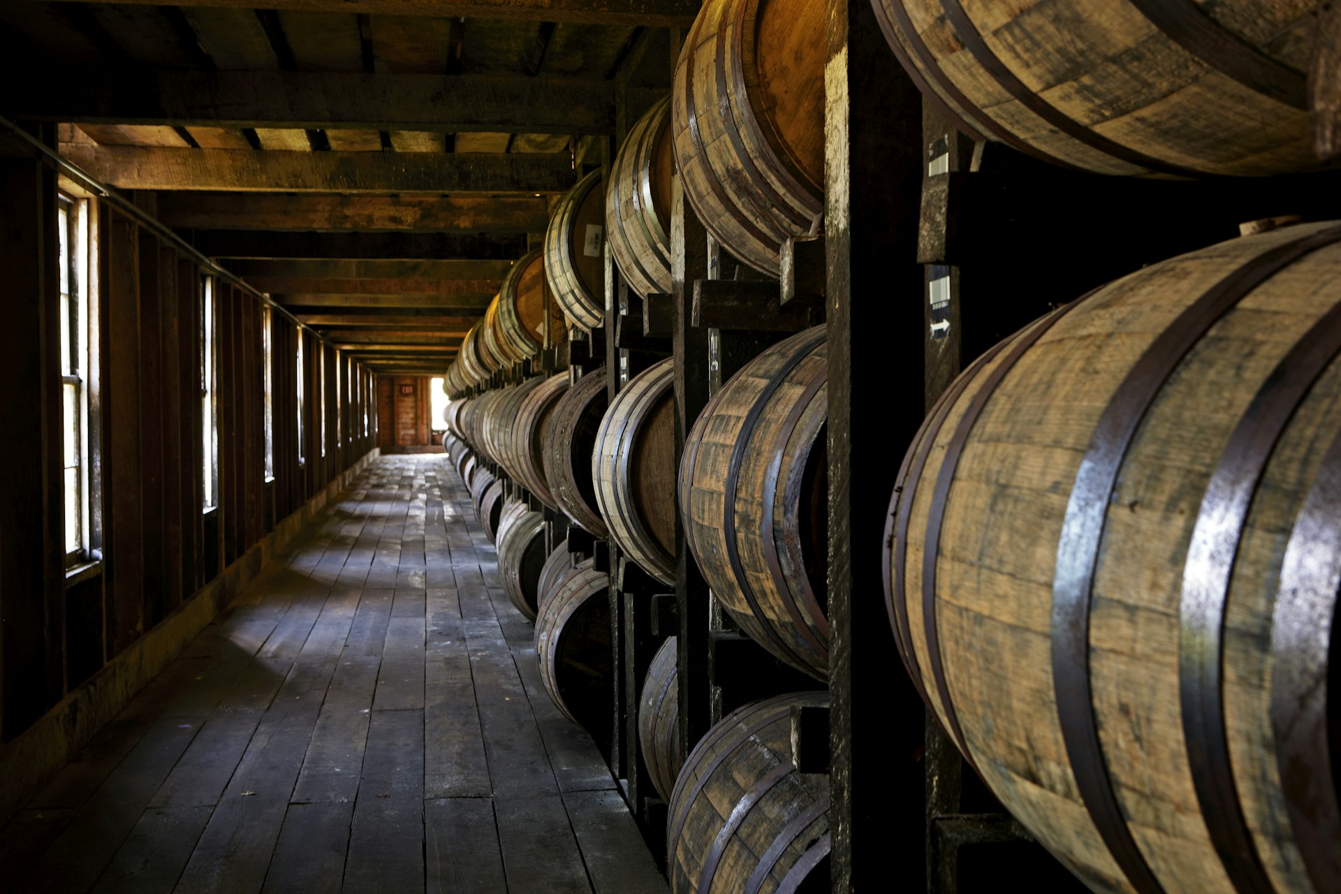 Barrels of bourbon whiskey in a rick house (storage barn) at Heaven Hill Distillery, Bardstown