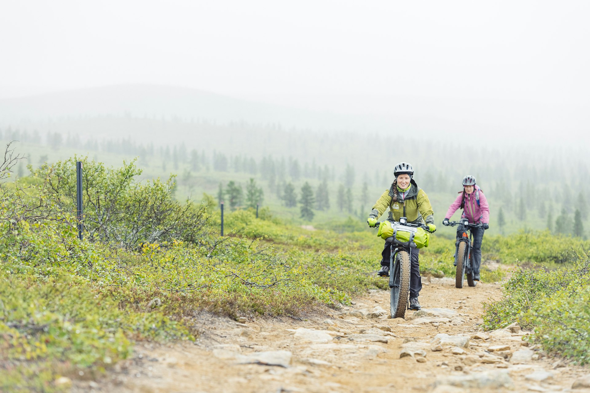 Cycling on electric fat bikes through Urho Kekkonen National Park.
