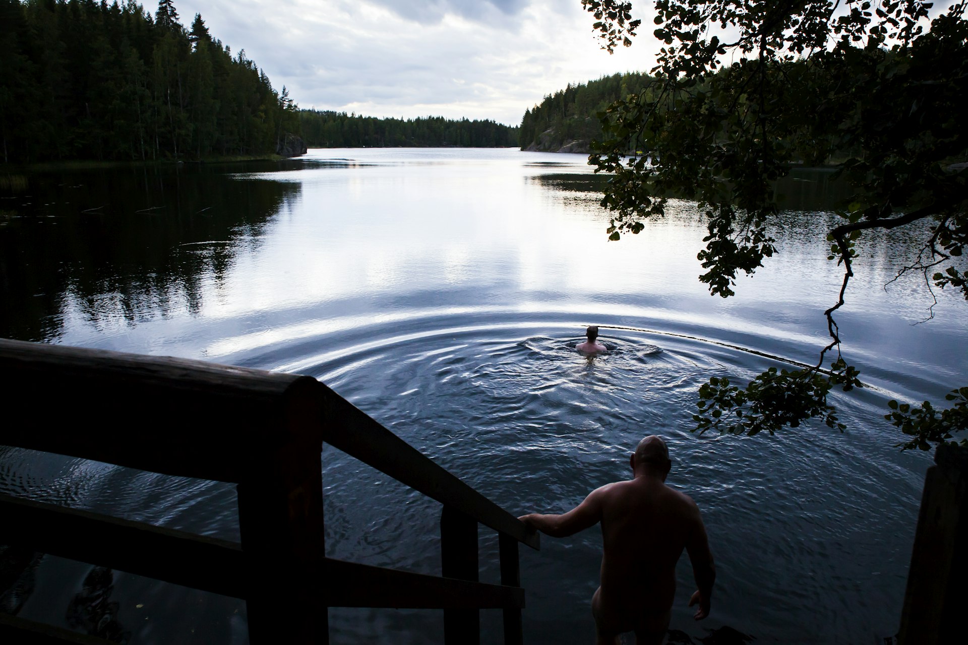 Bathing in Lake Saimaa after a sauna in Finland 