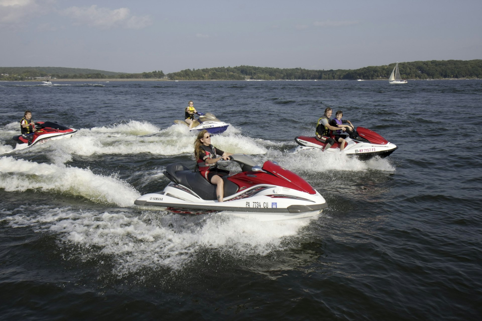A group of people ride jet skis on Lake Wallenpaupack in Pennsylvania.