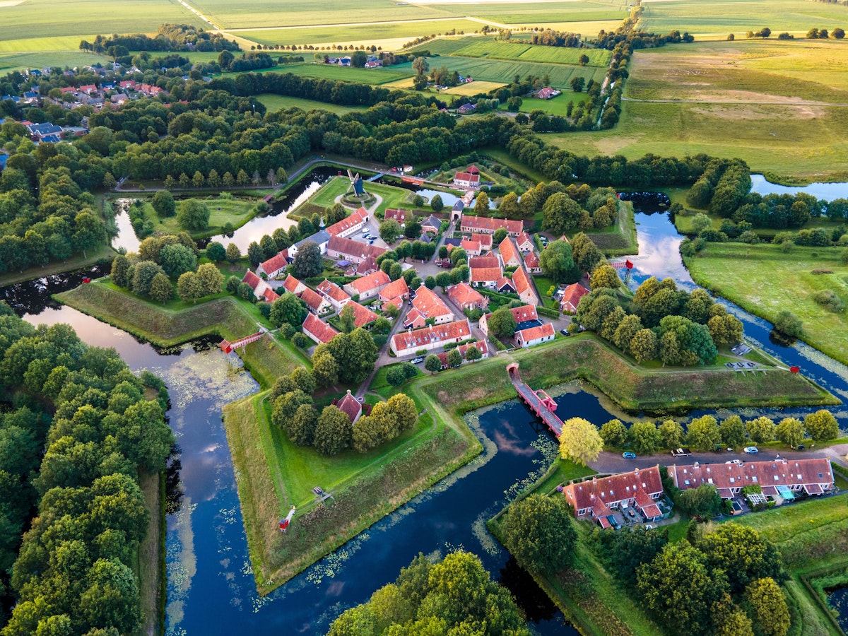 Bourtange Fortress aerial view during sunset in the Province of Groningen. Fortress in shape of star near border of Netherlands and Germany.; Shutterstock ID 1960078267; your: Bridget Brown; gl: 65050; netsuite: Online Editorial; full: POI Image Update