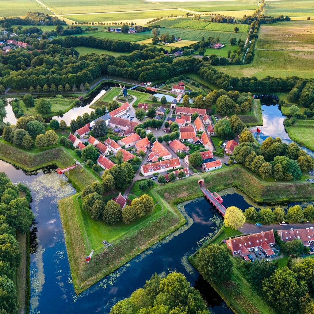 Bourtange Fortress aerial view during sunset in the Province of Groningen. Fortress in shape of star near border of Netherlands and Germany.; Shutterstock ID 1960078267; your: Bridget Brown; gl: 65050; netsuite: Online Editorial; full: POI Image Update