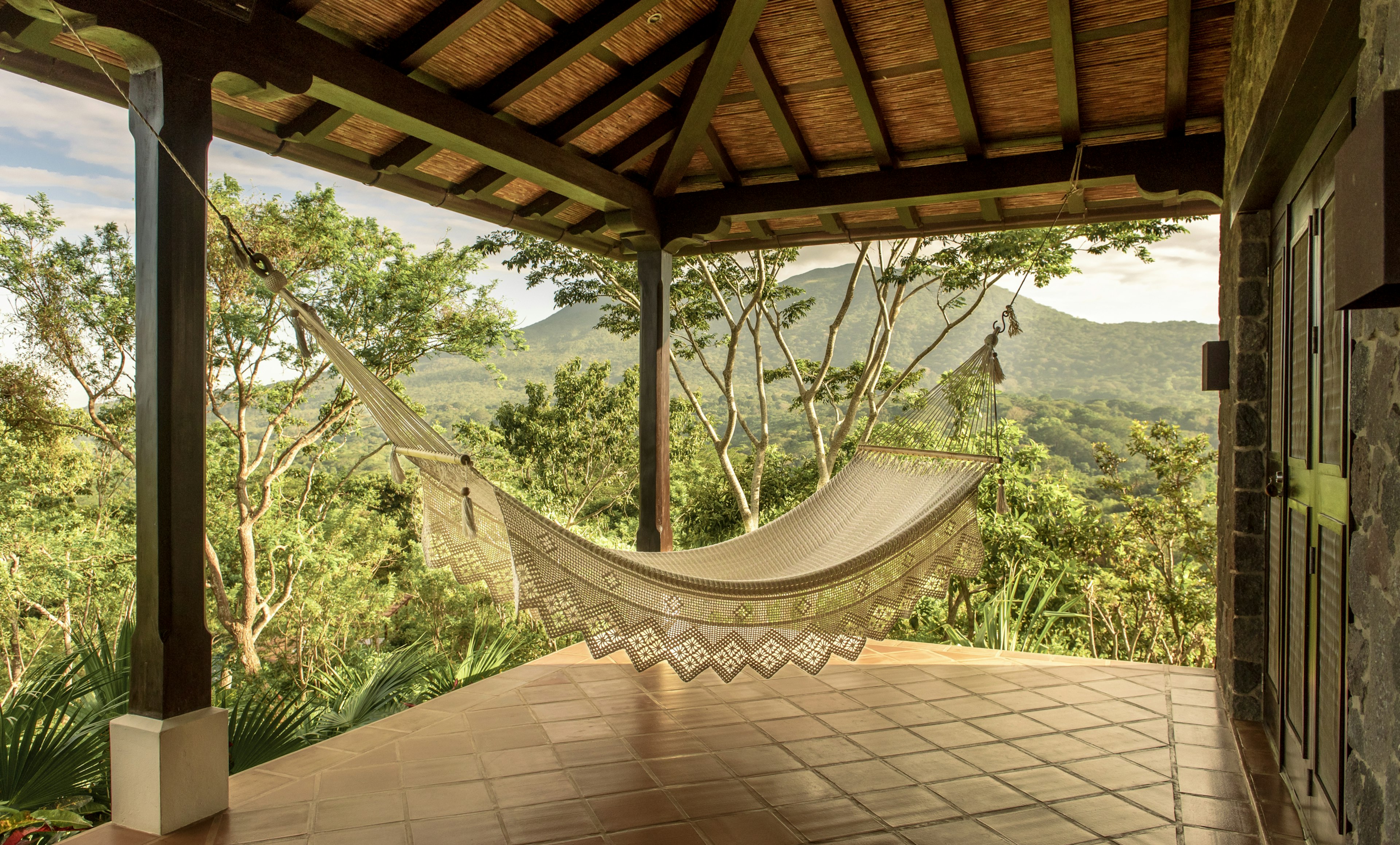 A hammock on a terrace looking out over the jungle at El Respiro in Nicaragua