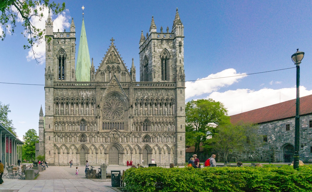 Trondheim, Norway - June 6, 2017:  View of the world's northernmost medieval cathedral national sanctuary of Norway, built over the grave of St. Olav. The sculptures and church in romanesque style; 
Nidaros Domkirke

Shutterstock ID 659296807; your: Bridget Brown; gl: 65050; netsuite: Online Editorial; full: POI Image Update
