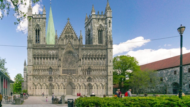 Trondheim, Norway - June 6, 2017:  View of the world's northernmost medieval cathedral national sanctuary of Norway, built over the grave of St. Olav. The sculptures and church in romanesque style; 
Nidaros Domkirke

Shutterstock ID 659296807; your: Bridget Brown; gl: 65050; netsuite: Online Editorial; full: POI Image Update