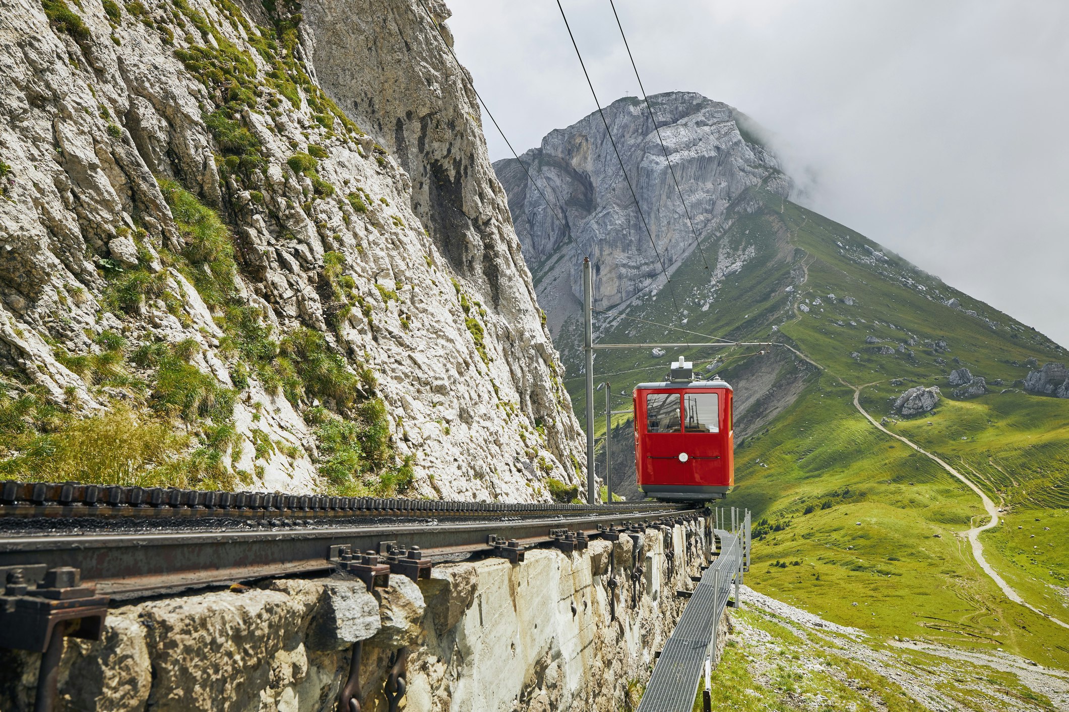 Cogwheel train passing mountain landscape of Mount Pilatus in the Swiss Alps, near Lucerne