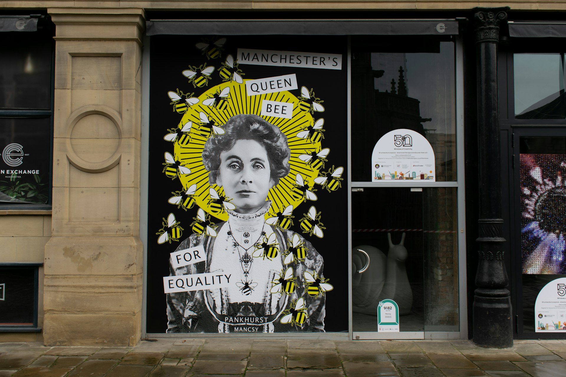 A mural of Emmeline Pankhurst on a wall in Manchester city center