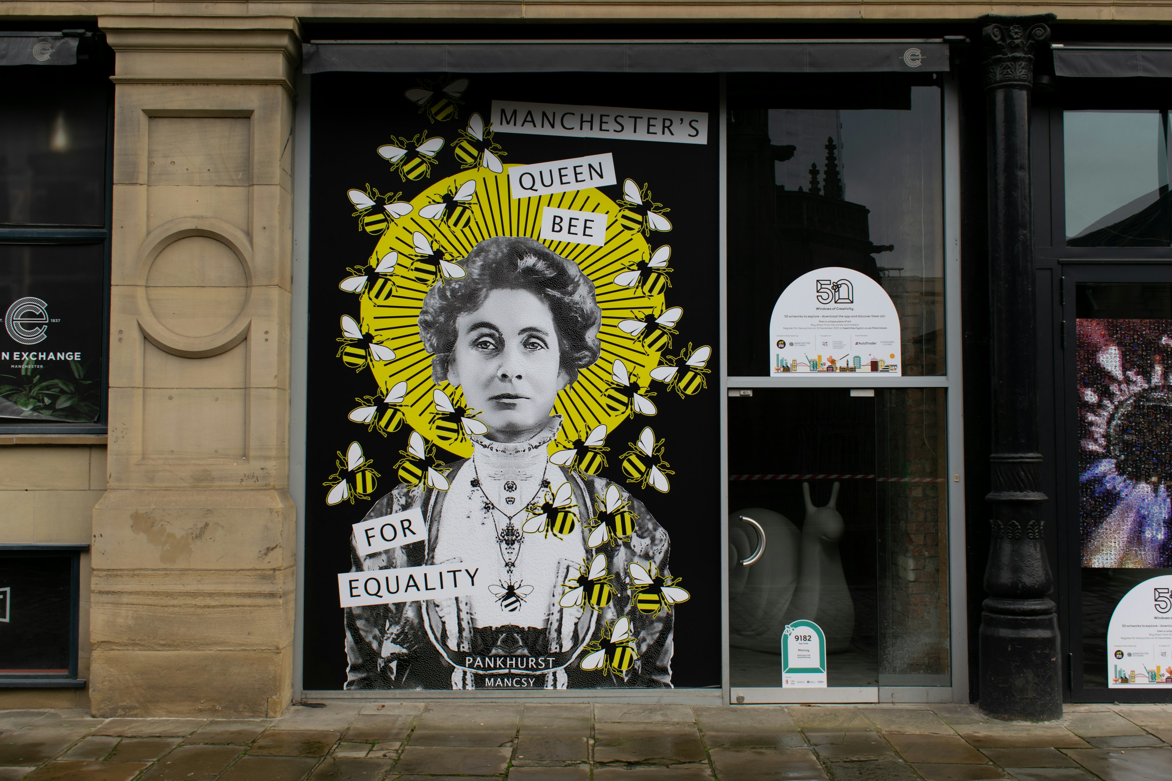 A mural of Emmeline Pankhurst on a wall in Manchester city center