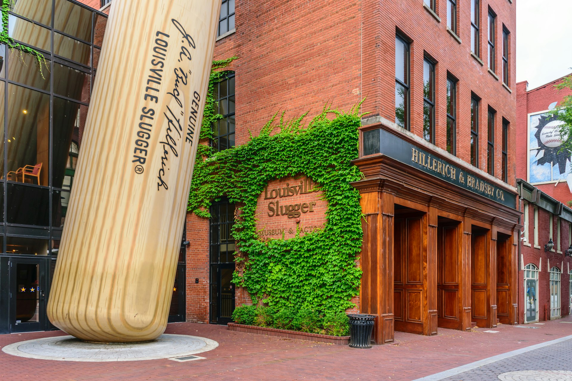 Exterior of the  Louisville Slugger Museum & Factory in downtown Louisville, Kentucky including a giant baseball bat propped up outside