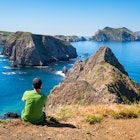 Traveller resting at breathtaking landscape on Anacapa Island. Anacapa Island is one of the five islands which form the Channel Islands National Park, near Los Angeles, California, USA
