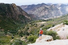 A woman stops to enjoy the views on the Gaviota Peak hike.
