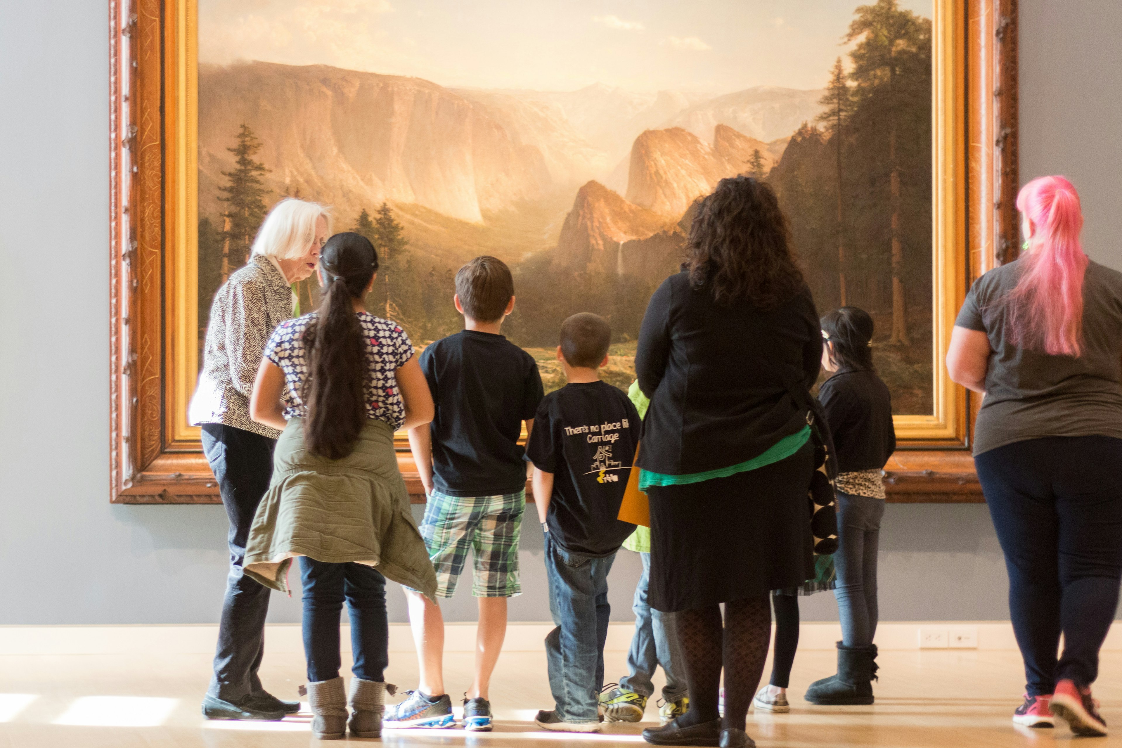 A group of people looking at a painting at the Crocker Art Museum, Sacramento, California