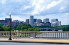 A runner crosses the Arlington Memorial Bridge over the Potomac River. - stock photo