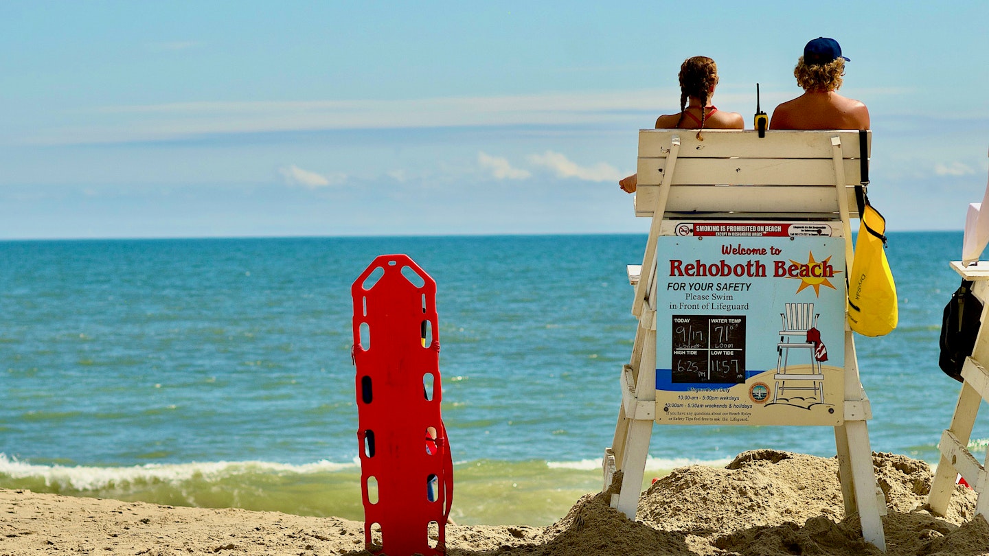 Rehoboth Beach, Delaware / USA - September 17, 2017: Two lifeguards remain vigilant on a hot summer day at the popular beach destination.