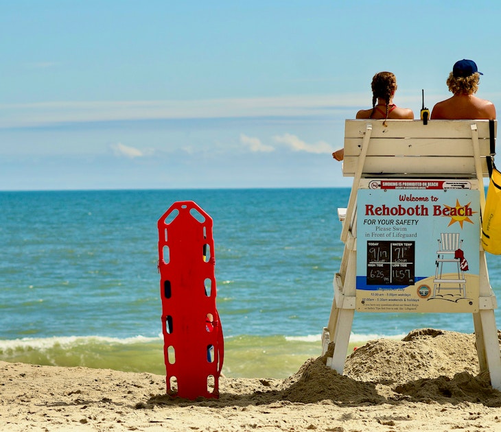 Rehoboth Beach, Delaware / USA - September 17, 2017: Two lifeguards remain vigilant on a hot summer day at the popular beach destination.