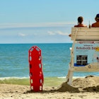 Rehoboth Beach, Delaware / USA - September 17, 2017: Two lifeguards remain vigilant on a hot summer day at the popular beach destination.