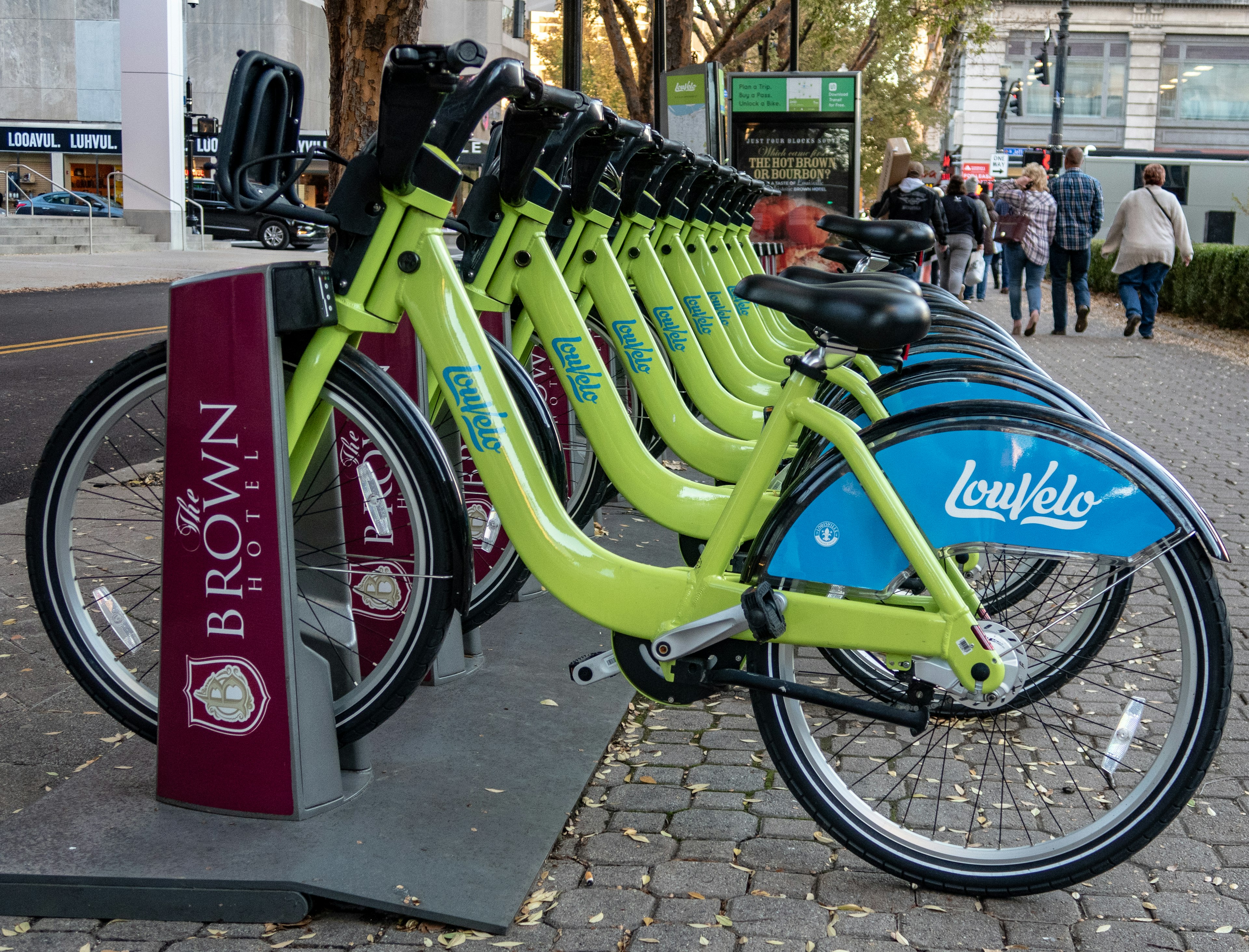 A row of green LouVelo bikes in their docks in Louisville, Kentucky